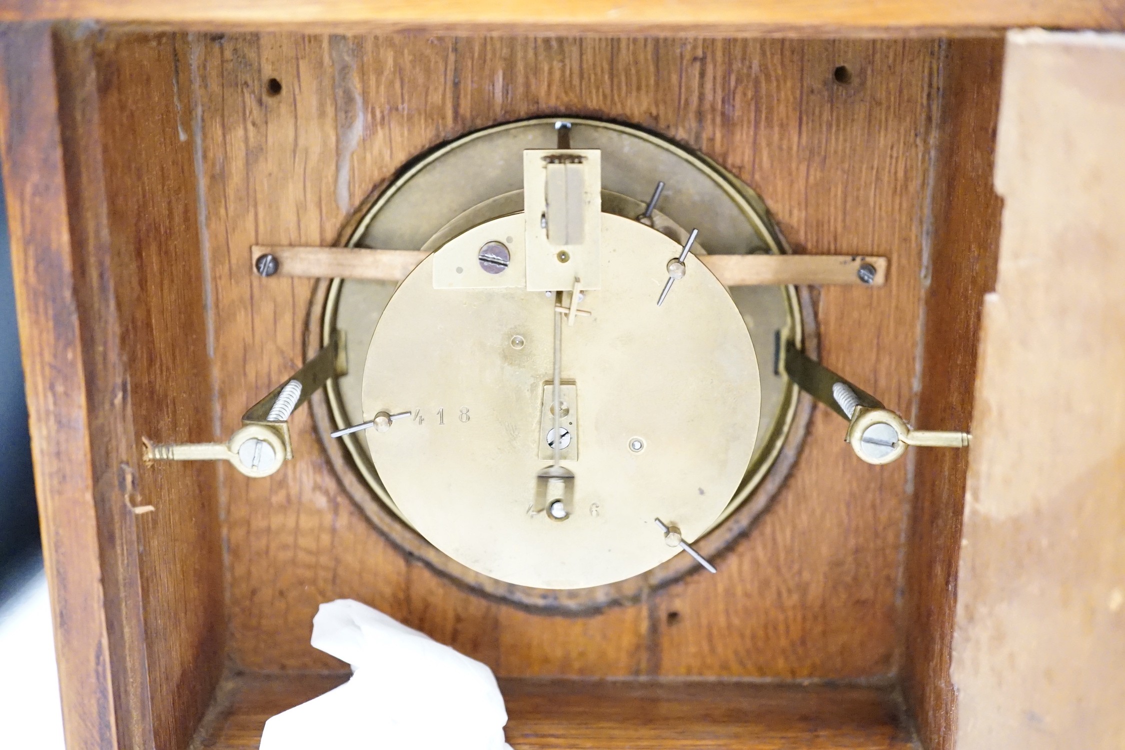 A Garrard clock and an oak brass mounted clock 29cms high